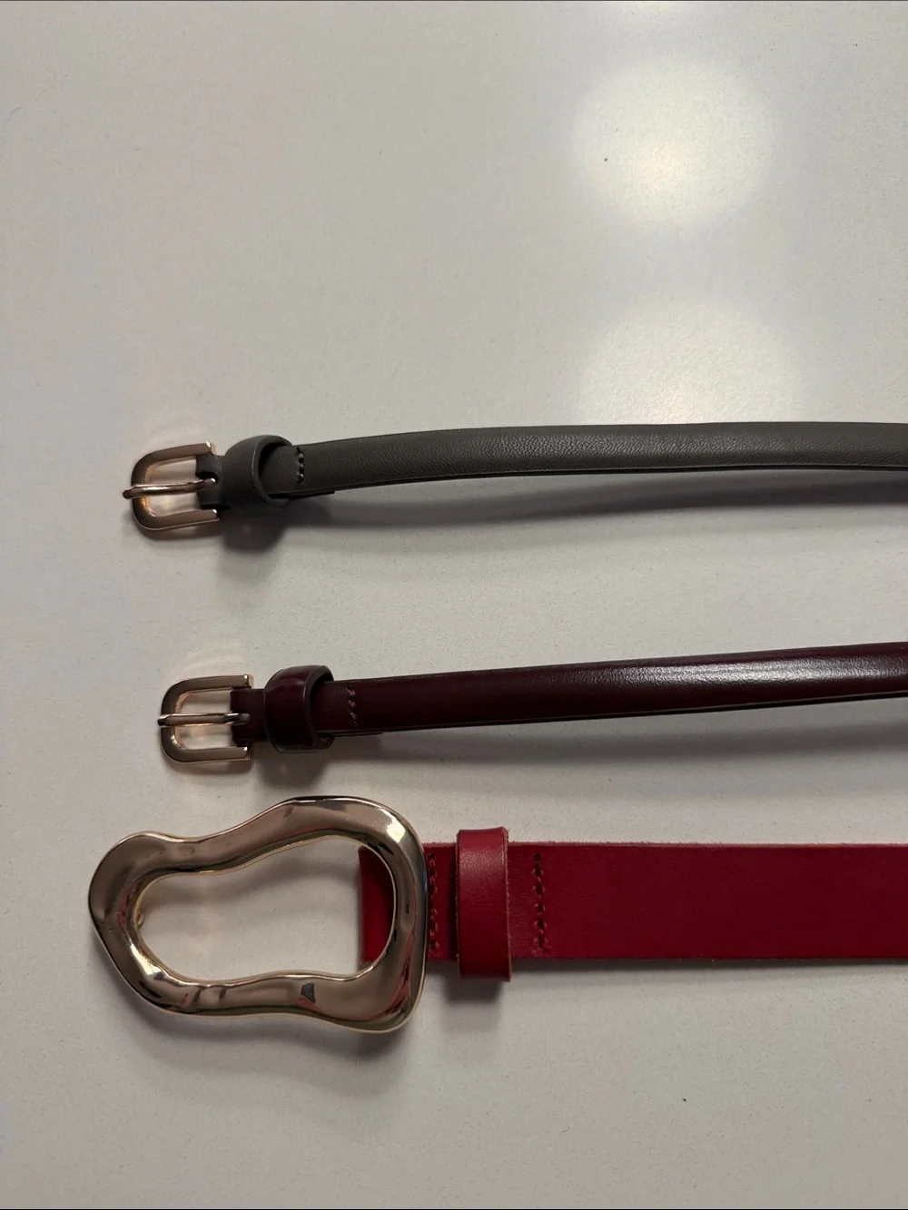 Three pair bundle. Anthropologie Red Leather Waist Belt, H&Mgrey and plum belt.